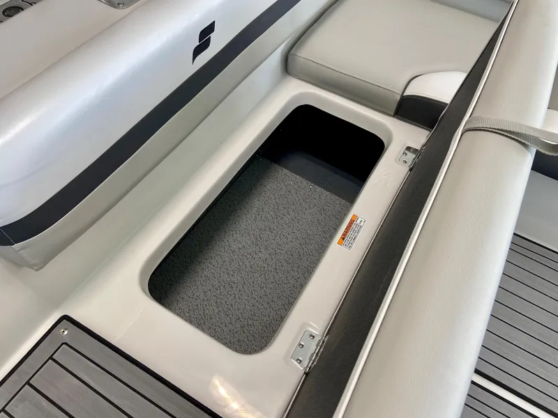 Slide: The Image of 2024 Starcraft SVX 211 Electric Blue Sport boat storage compartment. - 10