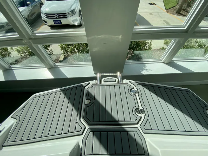 Slide: The Image of 2024 Starcraft SVX 211 Electric Blue Sport boat deck with non-slip surface. - 28