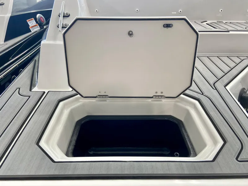 Slide: The Image of 2024 Starcraft SVX 211 Electric Blue Sport boat storage compartment. - 3