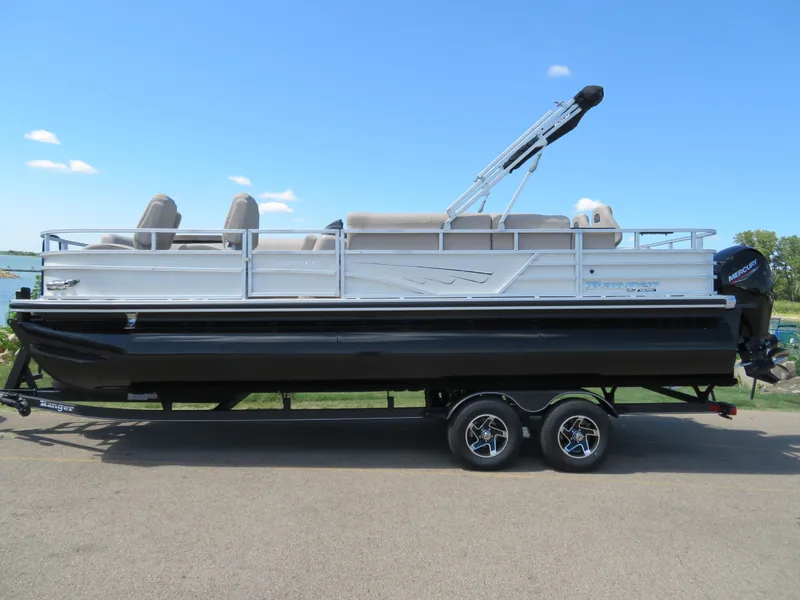 Slide: The Image of 2024 Ranger 223FC pontoon boat on a trailer, side view. - 1