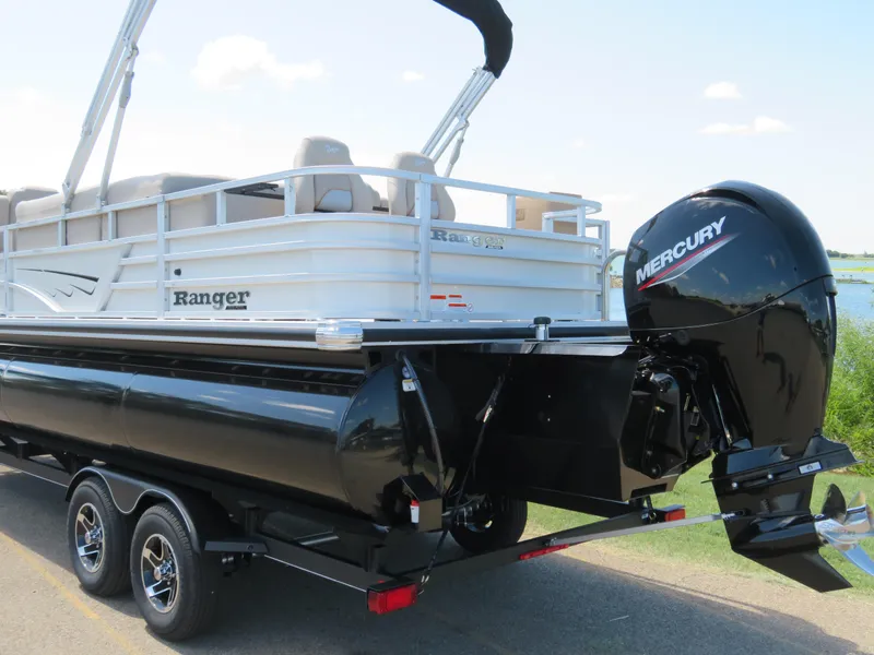 Slide: The Image of 2024 Ranger 223FC pontoon boat with Mercury outboard motor on trailer. - 3