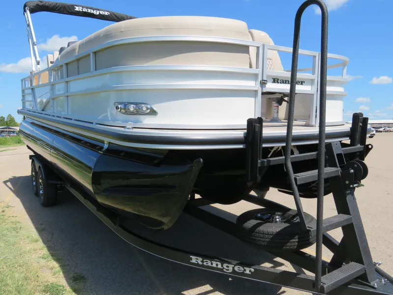 Slide: The Image of 2024 Ranger 223FC pontoon boat on trailer, side view. - 4