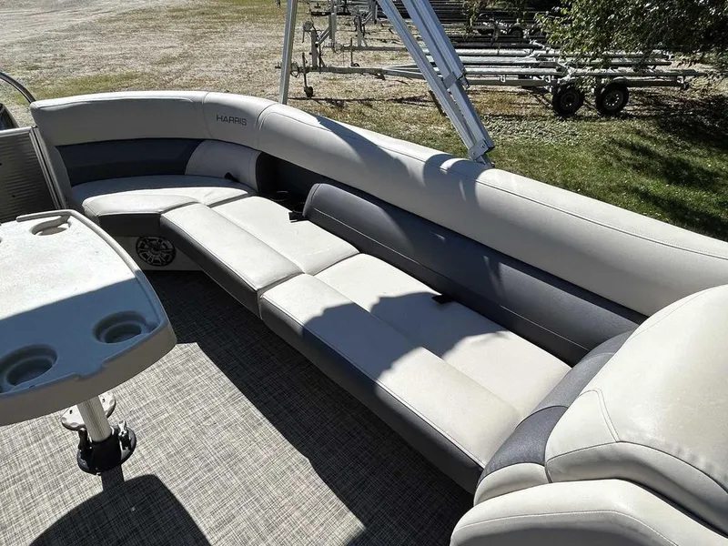 Slide: The Image of 2021 Harris Cruiser 250 boat interior with spacious seating and cup holders. - 12