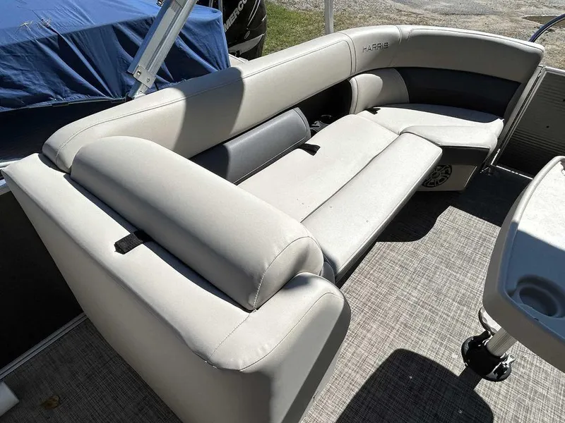 Slide: The Image of 2021 Harris Cruiser 250 boat interior with comfortable seating. - 13