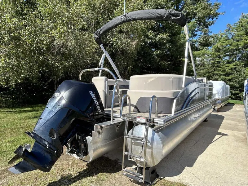 Slide: The Image of 2021 Harris Cruiser 250 pontoon boat with Mercury outboard motor. - 5