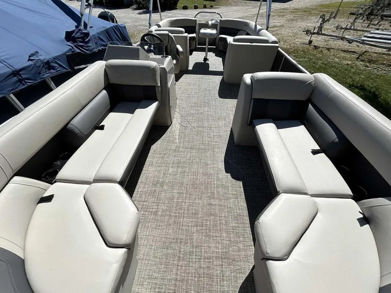 Slide: The Image of 2021 Harris Cruiser 250 pontoon boat interior with spacious seating and modern design. - 6