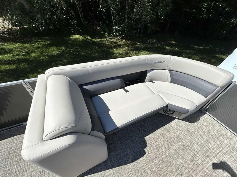 Slide: The Image of 2021 Harris Cruiser 250 boat with luxurious seating. - 8