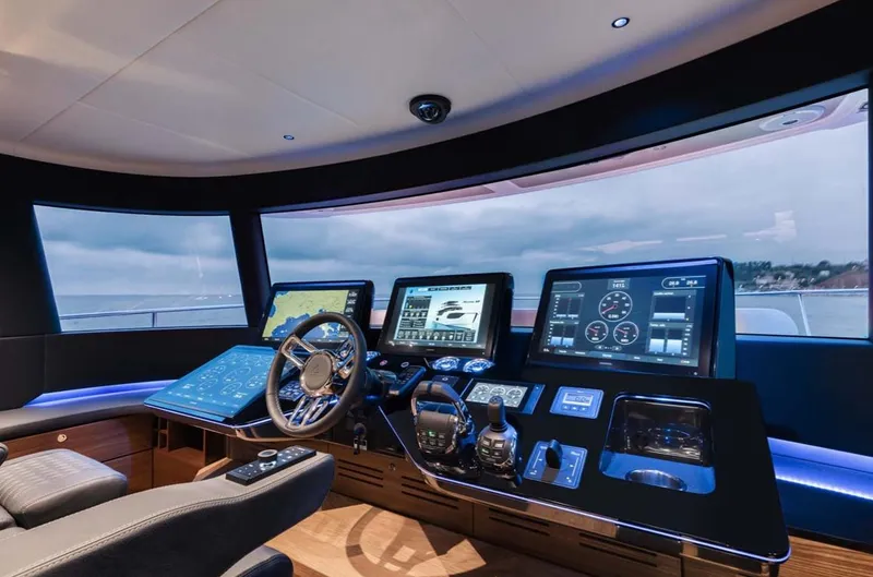 Slide: The Image of Modern helm station of the 2024 Absolute 68 NAVETTA yacht with advanced navigation systems. - 13
