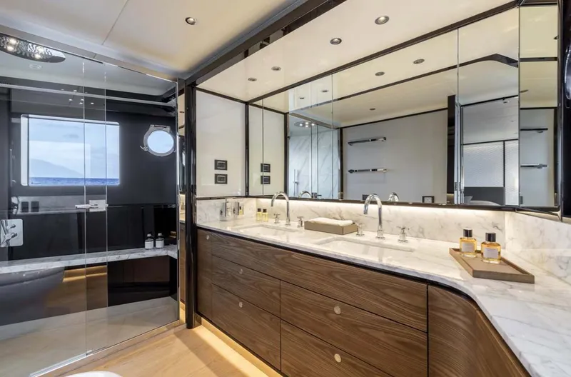 Slide: The Image of Luxurious bathroom in the 2024 Absolute 68 NAVETTA yacht with dual sinks and modern fixtures. - 17