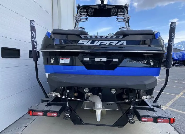 Slide: The Image of 2022 Supra SE boat rear view at dock. - 4