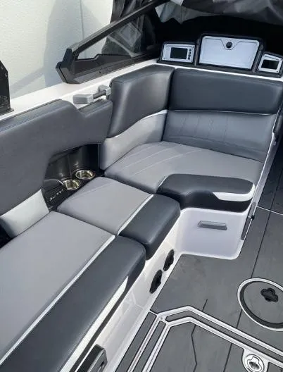 Slide: The Image of 2022 Supra SE boat interior with luxurious black and gray seating. - 6