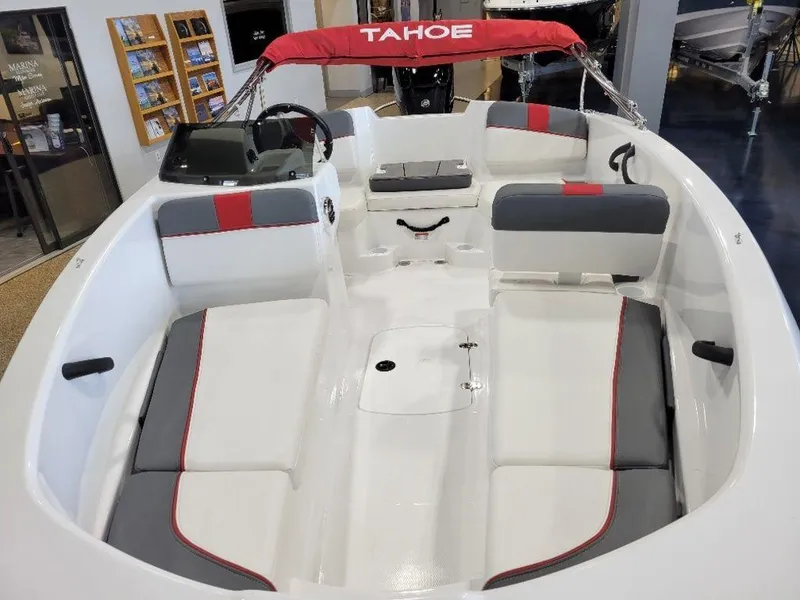 Slide: The Image of 2024 Tahoe T16 boat interior with red and gray seating, white deck, and red canopy. - 6