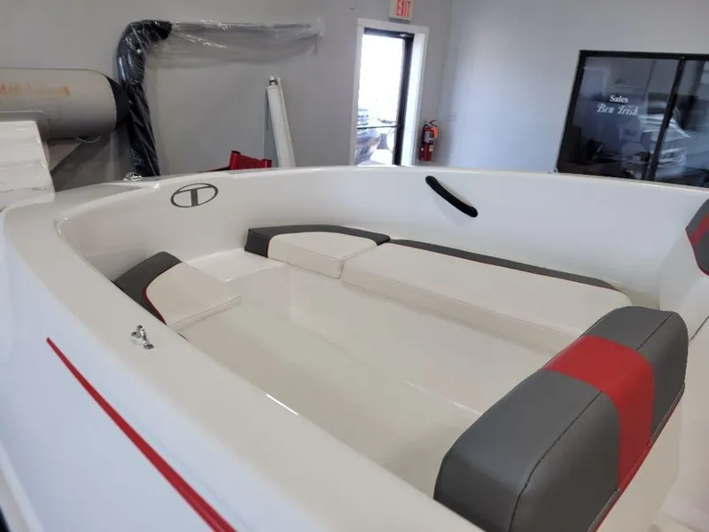 Slide: The Image of 2024 Tahoe T16 boat interior with white and red seating. - 8