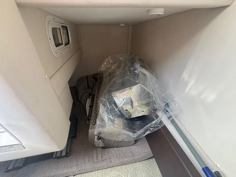 Slide: The Image of Interior storage area of a 2015 Sea Ray 260 Sundancer boat. - 13