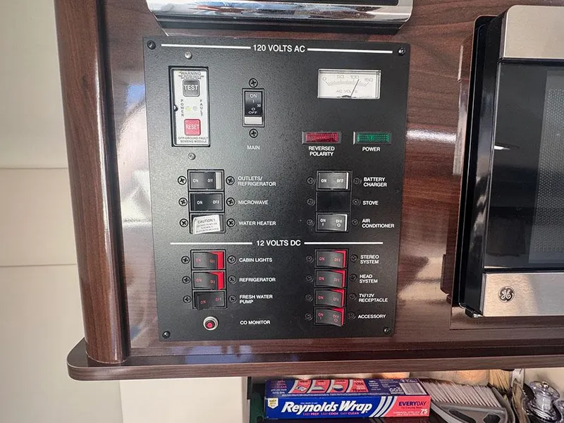 Slide: The Image of Electrical control panel on a 2015 Sea Ray 260 Sundancer boat. - 14