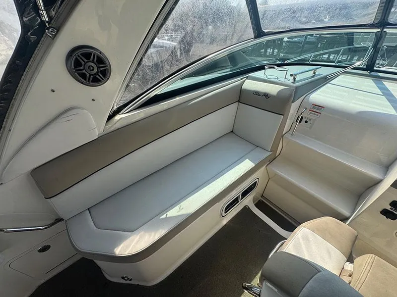 Slide: The Image of Interior of 2015 Sea Ray 260 Sundancer boat, featuring cushioned seating and sleek design. - 18