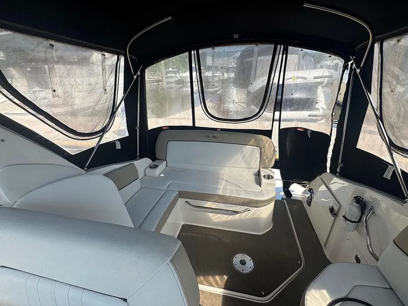 Slide: The Image of Interior of 2015 Sea Ray 260 Sundancer boat with seating and canopy. - 19