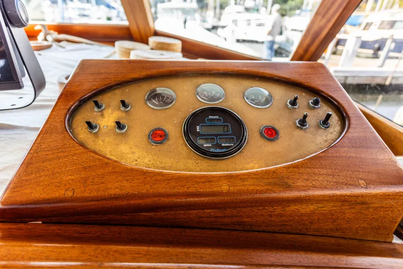 Slide: The Image of Control panel of a 2009 Custom Gartside Downeast Cruiser with wooden finish. - 10