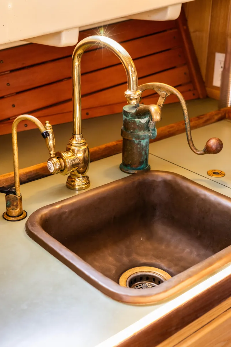 Slide: The Image of 2009 Custom Gartside Downeast Cruiser sink with brass and bronze fixtures. - 16