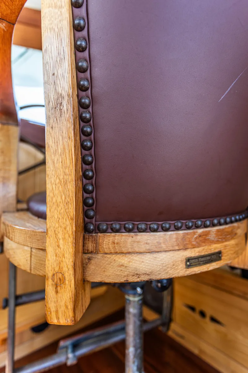 Slide: The Image of Close-up of a 2009 Custom Gartside Downeast Cruiser's wooden and leather chair. - 19
