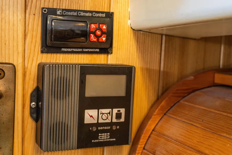 Slide: The Image of 2009 Custom Gartside Downeast Cruiser climate control and electrical system panel - 22