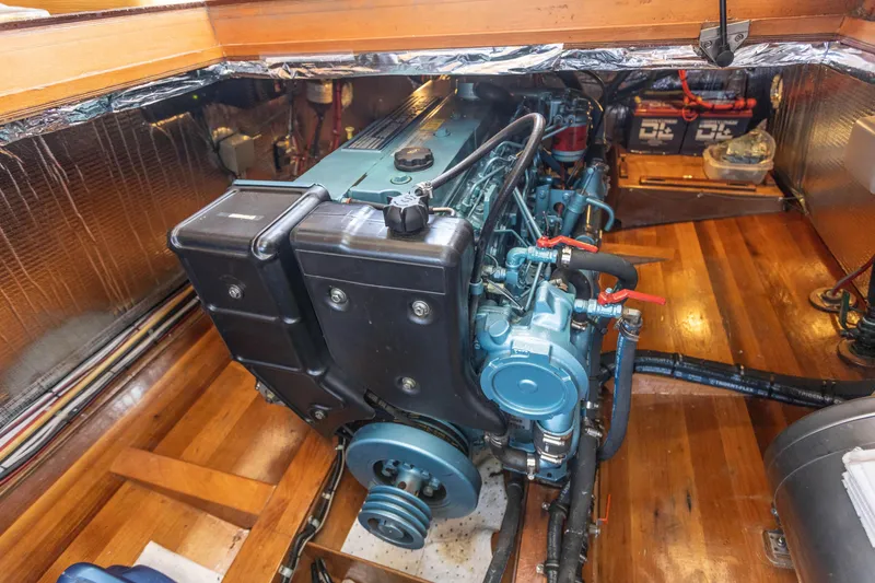 Slide: The Image of Engine room of a 2009 Custom Gartside Downeast Cruiser with a well-maintained marine engine. - 29