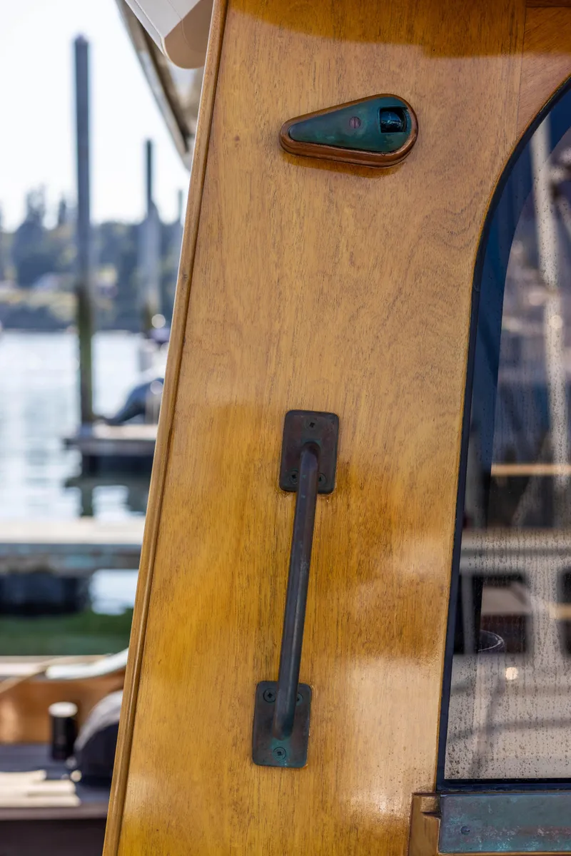 Slide: The Image of Close-up of 2009 Custom Gartside Downeast Cruiser wooden cabin door handle. - 32