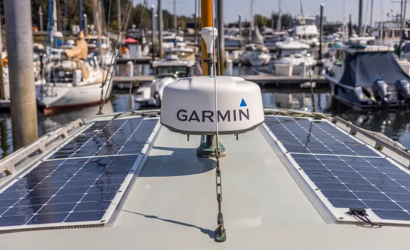 Slide: The Image of 2009 Custom Gartside Downeast Cruiser with Garmin radar and solar panels at marina. - 37