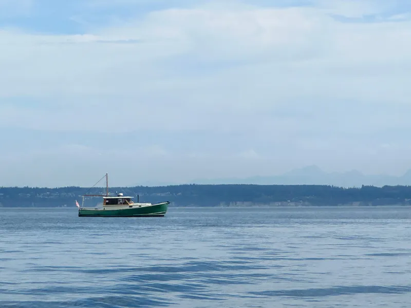Slide: The Image of Custom 2009 Gartside Downeast Cruiser on calm waters with distant shoreline. - 4