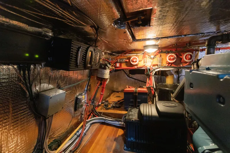 Slide: The Image of Engine room of 2009 Custom Gartside Downeast Cruiser with wiring and equipment. - 42