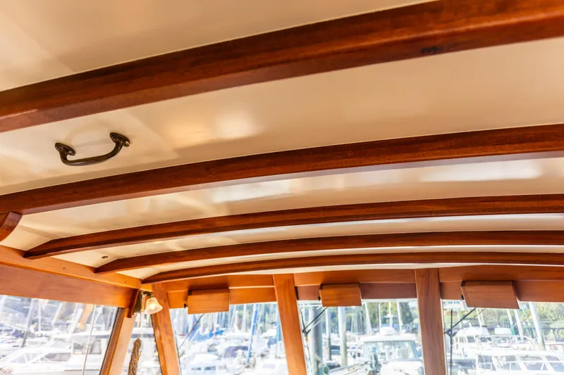 Slide: The Image of Wooden interior ceiling of 2009 Custom Gartside Downeast Cruiser with marina view. - 6