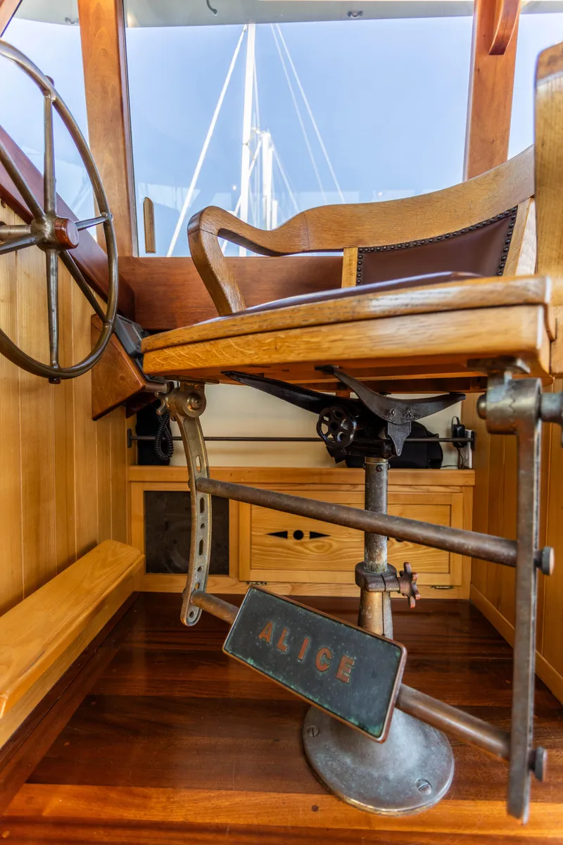 Slide: The Image of 2009 Custom Gartside Downeast Cruiser helm station with wooden chair and steering wheel. - 7