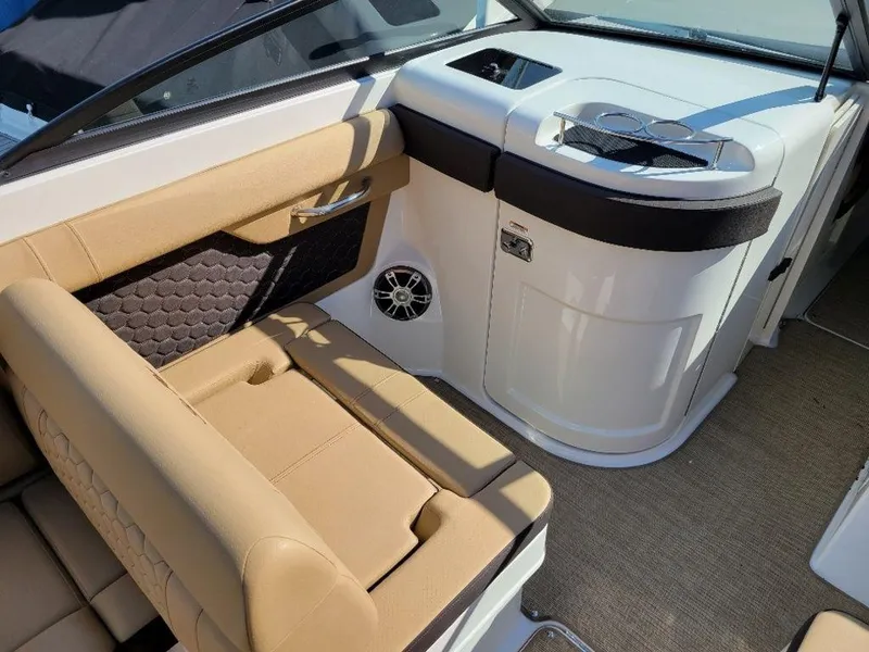 Slide: The Image of 2024 Sea Ray SDX 270 boat interior with tan seating and modern design. - 4