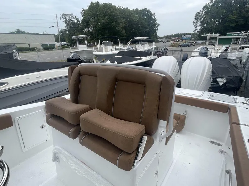 Slide: The Image of 2024 Sea Hunt Gamefish 27 FS boat with brown cushioned seating. - 3