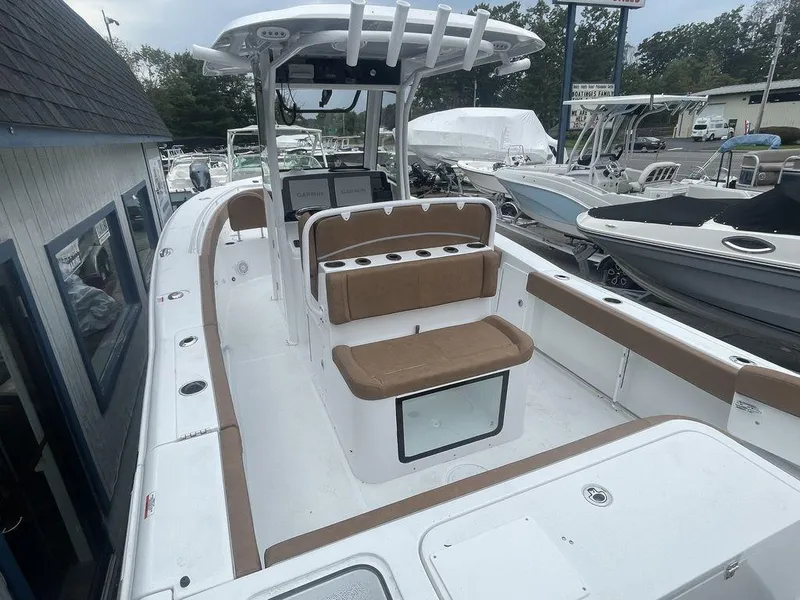 Slide: The Image of 2024 Sea Hunt Gamefish 27 FS boat interior with seating and console. - 4
