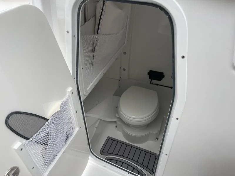 Slide: The Image of 2024 Sea Hunt Gamefish 27 FS boat interior with marine toilet. - 9