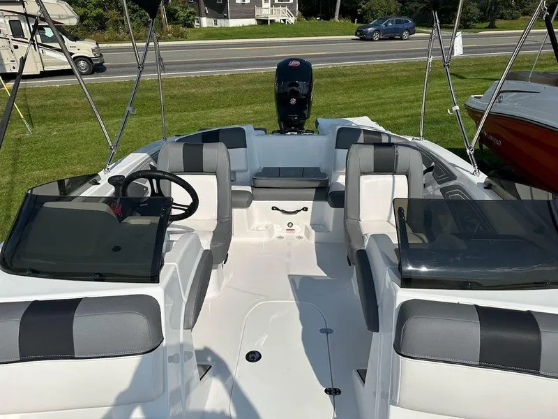 Slide: The Image of 2024 Tahoe T21 boat interior with seating and steering wheel. - 10