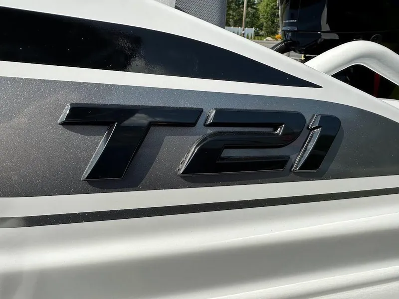 Slide: The Image of 2024 Tahoe T21 boat model emblem in close-up view. - 5