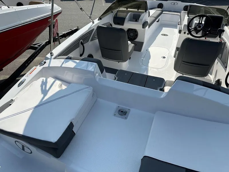 Slide: The Image of 2024 Tahoe T21 boat interior with seating and steering console. - 9