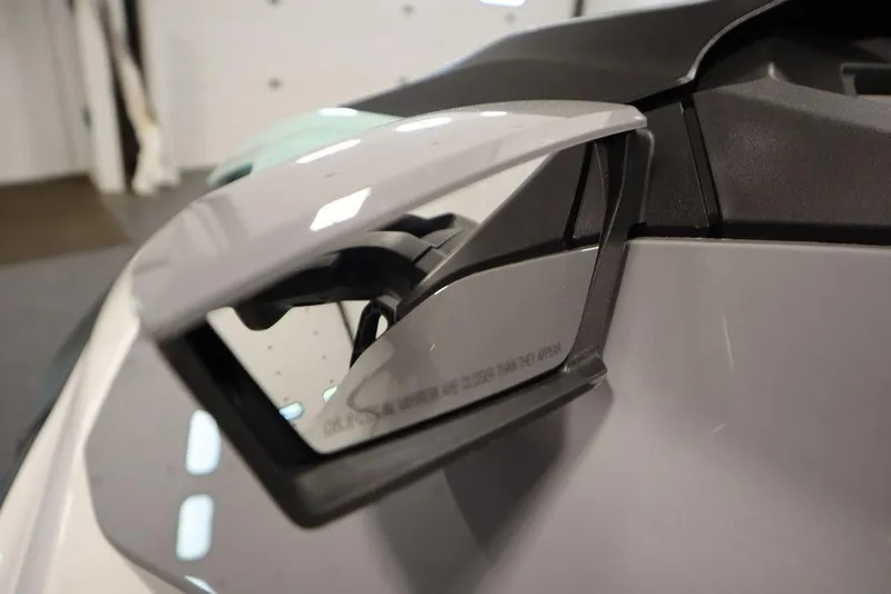 Slide: The Image of Close-up of 2025 Sea-Doo GTI 130 side mirror, sleek design. - 16