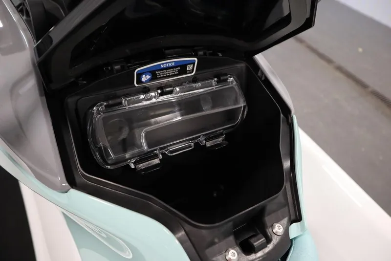 Slide: The Image of 2025 Sea-Doo GTI 130 storage compartment with clear lid, open view. - 20