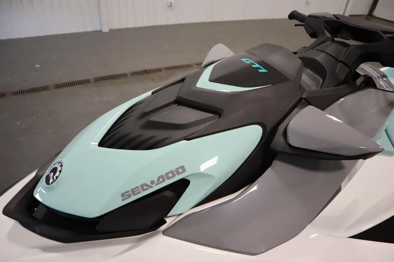 Slide: The Image of 2025 Sea-Doo GTI™ 130 jet ski, sleek design, mint and gray color scheme. - 5
