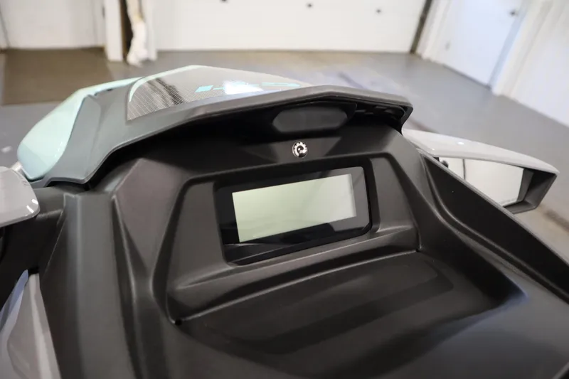 Slide: The Image of 2025 Sea-Doo GTI™ 130 dashboard display in a garage setting. - 8