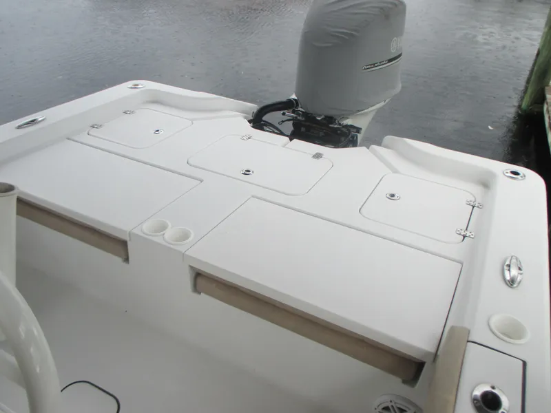 Slide: The Image of 2019 Sportsman 267 Masters boat stern with storage compartments and outboard motor. - 8