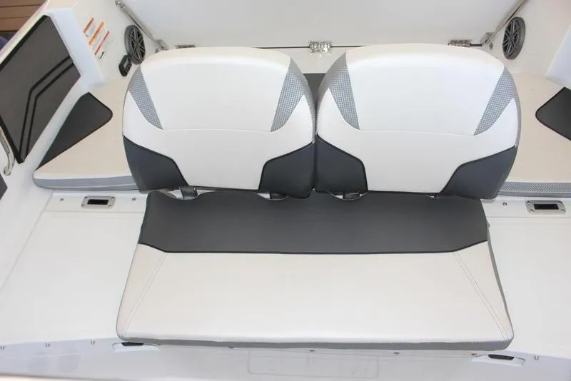 Slide: The Image of 2023 Scarab 255 ID boat interior seating with white and black upholstery. - 10