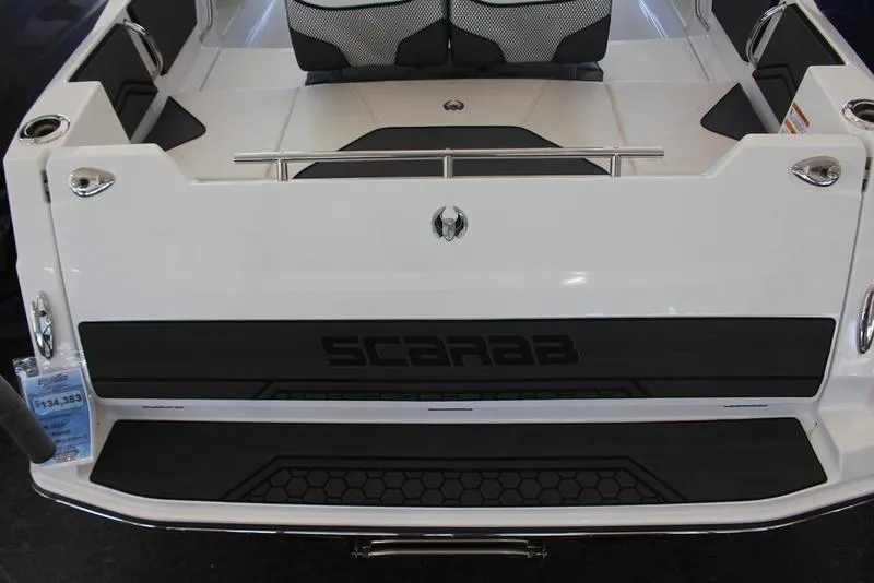 Slide: The Image of 2023 Scarab 255 ID boat rear view with seating and logo. - 12