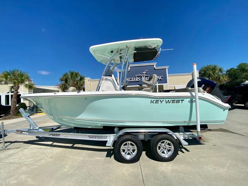 The Image of 2024 Key West 219 FS boat on trailer at Angler's Marine Inc. dealership. - 0