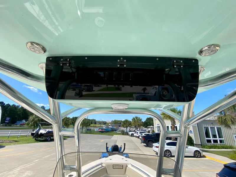 Slide: The Image of 2024 Key West 219 FS boat console and T-top view. - 13