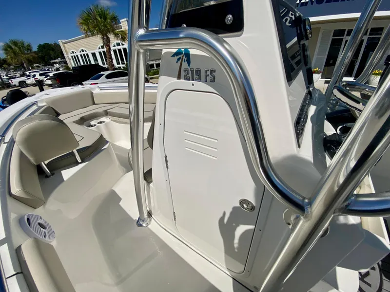 Slide: The Image of 2024 Key West 219 FS boat interior with seating and console. - 15