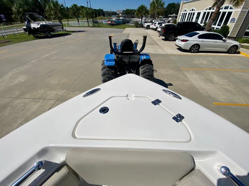 Slide: The Image of 2024 Key West 219 FS boat on trailer in parking lot. - 22